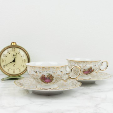 Pareja de tazas y platos de te de porcelana francesa