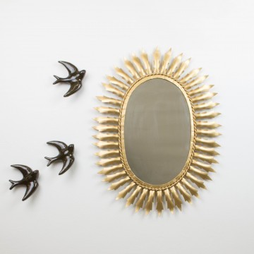 Antiguo espejo sol ovalado